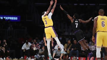 Nov 26, 2021; Los Angeles, California, USA; Los Angeles Lakers forward Anthony Davis (3) shoots a ball over Sacramento Kings forward Chimezie Metu (7) during the first quarter at Staples Center. Mandatory Credit: Kiyoshi Mio-USA TODAY Sports