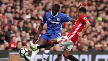 MANCHESTER, ENGLAND - APRIL 16: Kurt Zouma of Chelsea competes with Jesse Lingard of Manchester United during the Premier League match between Manchester United and Chelsea at Old Trafford on April 16, 2017 in Manchester, England. (Photo by Matthew Ashton - AMA/Getty Images)