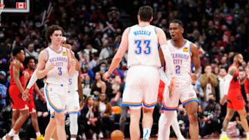 Mike Muscala #33 of the Oklahoma City Thunder celebrates his game-winning three pointer with Shai Gilgeous-Alexander #2 against the Toronto Raptors during the second half of their basketball game at the Scotiabank Arena on December 8, 2021 in Toronto, Ontario, Canada. NOTE TO USER: User expressly acknowledges and agrees that, by downloading and/or using this Photograph, user is consenting to the terms and conditions of the Getty Images License Agreement. (Photo by Mark Blinch/Getty Images)
