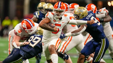 Sep 5, 2022; Atlanta, Georgia, USA; Clemson Tigers quarterback DJ Uiagalelei (5) breaks away from a tackle by Georgia Tech Yellow Jackets defensive lineman Kyle Kennard (9) during the first half at Mercedes-Benz Stadium. Mandatory Credit: Dale Zanine-USA TODAY Sports