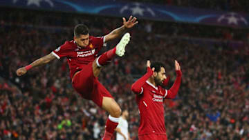 LIVERPOOL, ENGLAND - APRIL 24: Mohamed Salah of Liverpool celebrates as he scores his sides second goal with Roberto Firmino during the UEFA Champions League Semi Final First Leg match between Liverpool and A.S. Roma at Anfield on April 24, 2018 in Liverpool, United Kingdom. (Photo by Clive Brunskill/Getty Images)