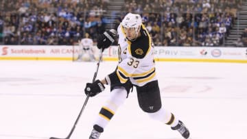 Mar 26, 2016; Toronto, Ontario, CAN; Boston Bruins defenseman Zdeno Chara (33) shoots against the Toronto Maple Leafs at Air Canada Centre. The Bruins beat the Maple Leafs 3-1. Mandatory Credit: Tom Szczerbowski-USA TODAY Sports