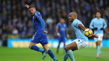 LEICESTER, ENGLAND - NOVEMBER 18: Jamie Vardy of Leicester City and Vincent Kompany of Manchester City compete for the ball during the Premier League match between Leicester City and Manchester City at The King Power Stadium on November 18, 2017 in Leicester, England. (Photo by Richard Heathcote/Getty Images)