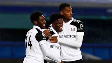 LIVERPOOL, ENGLAND - FEBRUARY 14: Josh Maja of Fulham celebrates with team mates Ola Aina and Tosin Adarabioyo after scoring their side's second goal during the Premier League match between Everton and Fulham at Goodison Park on February 14, 2021 in Liverpool, England. Sporting stadiums around the UK remain under strict restrictions due to the Coronavirus Pandemic as Government social distancing laws prohibit fans inside venues resulting in games being played behind closed doors. (Photo by Jason Cairnduff - Pool/Getty Images)