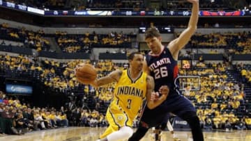 Apr 19, 2014; Indianapolis, IN, USA; Indiana Pacers guard George Hill (3) drives to the basket against Atlanta Hawks forward Kyle Korver (26) in game one during the first round of the 2014 NBA Playoffs at Bankers Life Fieldhouse. Atlanta defeats Indiana 101-93. Mandatory Credit: Brian Spurlock-USA TODAY Sports