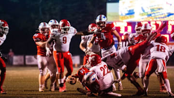 Auburn footballNov 4, 2022; Tuscaloosa, AL, USA; ACA's Carson Sute (14) is tackled by Munford's Kelby Tucker (22) and Sylvester Smith (11) as he approaches the in zone Friday, Nov. 4, 2022 at American Christian Academy.Football High School Football Playoffs Munford Vs Aca