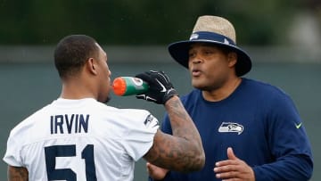 TEMPE, AZ - JANUARY 29: Linbacker coach Ken Norton Jr. (R) of the Seattle Seahawks talks with Bruce Irvin