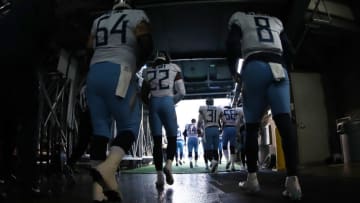 EAST RUTHERFORD, NEW JERSEY - DECEMBER 16: Josh Kline #64 and Marcus Mariota #8 of the Tennessee Titans join their team entering the field against the New York Giants during their game at MetLife Stadium on December 16, 2018 in East Rutherford, New Jersey. (Photo by Al Bello/Getty Images)