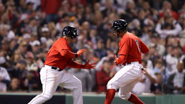 Xander Bogaerts #2 of the Boston Red Sox is congratulated by Rafael Devers #11 (Photo by Maddie Meyer/Getty Images)