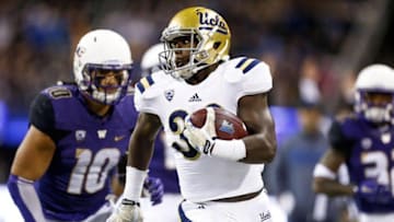 Nov 8, 2014; Seattle, WA, USA; UCLA Bruins running back Myles Jack (30) rushes for a 28-yard touchdown against the Washington Huskies during the second quarter at Husky Stadium. Mandatory Credit: Joe Nicholson-USA TODAY Sports