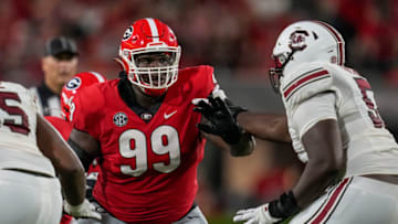 Sep 18, 2021; Athens, Georgia, USA; Georgia Bulldogs defensive lineman Jordan Davis (99) rushes against South Carolina Gamecocks offensive lineman Jaylen Nichols (52) during the first half at Sanford Stadium. Mandatory Credit: Dale Zanine-USA TODAY Sports