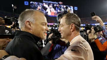 CHARLOTTE, NC - DECEMBER 02: Head coach Dabo Swinney of the Clemson Tigers greets head coach Mark Richt of the Miami Hurricanes on the field after the ACC Football Championship at Bank of America Stadium on December 2, 2017 in Charlotte, North Carolina. (Photo by Streeter Lecka/Getty Images)