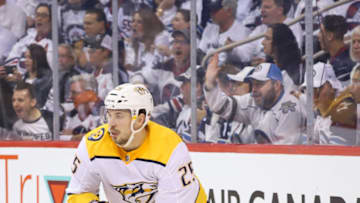 WINNIPEG, MB - MAY 1: Alexei Emelin #25 of the Nashville Predators plays the puck around the boards during third period action against the Winnipeg Jets in Game Three of the Western Conference Second Round during the 2018 NHL Stanley Cup Playoffs at the Bell MTS Place on May 1, 2018 in Winnipeg, Manitoba, Canada. The Jets defeated the Preds 7-4 and lead the series 2-1. (Photo by Darcy Finley/NHLI via Getty Images)