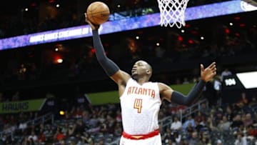 Feb 28, 2016; Atlanta, GA, USA; Atlanta Hawks forward Paul Millsap (4) grabs a rebound against the Charlotte Hornets in the second quarter at Philips Arena. Mandatory Credit: Brett Davis-USA TODAY Sports
