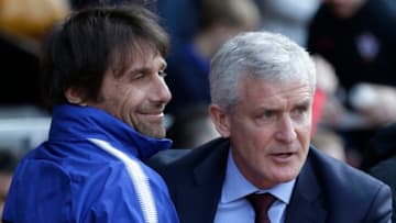 SOUTHAMPTON, ENGLAND - APRIL 14: Mark Hughes, Manager of Southampton greets Antonio Conte, Manager of Chelsea prior to the Premier League match between Southampton and Chelsea at St Mary's Stadium on April 14, 2018 in Southampton, England. (Photo by Henry Browne/Getty Images)