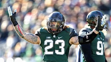 Nov 12, 2016; East Lansing, MI, USA; Michigan State Spartans linebacker Chris Frey (23) gestures to the sidelines during the first half of a game against the Rutgers Scarlet Knights at Spartan Stadium. Mandatory Credit: Mike Carter-USA TODAY Sports
