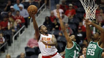 Apr 26, 2016; Atlanta, GA, USA; Atlanta Hawks guard Lamar Patterson (13) shoots the ball over Boston Celtics guard James Young (13) and forward Jordan Mickey (55) in the fourth quarter in game five of the first round of the NBA Playoffs at Philips Arena. The Hawks defeated the Celtics 110-83. The Hawks defeated the Celtics 110-83. Mandatory Credit: Brett Davis-USA TODAY Sports