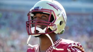 Apr 12, 2014; Tallahassee, FL, USA; Florida State Seminoles former linebacker Christian Jones (7) smiles as he models the new uniforms during the spring game at Doak Campbell Stadium. Mandatory Credit: Melina Vastola-USA TODAY Sports