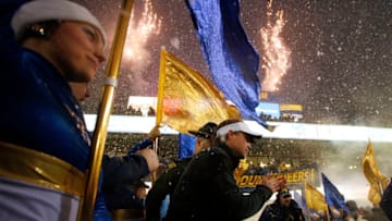MORGANTOWN, WV - NOVEMBER 19: Dana Holgorsen of the West Virginia Mountaineers enters the field against the Oklahoma Sooners on November 19, 2016 at Mountaineer Field in Morgantown, West Virginia. (Photo by Justin K. Aller/Getty Images)