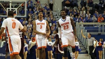 Jan 10, 2015; Gainesville, FL, USA ; Florida Gators forward Chris Walker (23), forward Devin Robinson (3) and guard Kasey Hill (0) celebrate after Florida Gators forward Alex Murphy (5) (not pictured) funked against the Mississippi State Bulldogs during the first half at Stephen C. O