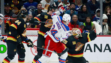 VANCOUVER, BC - JANUARY 4: Kaapo Kakko #24 of the New York Rangers looks on as Jacob Markstrom #25 of the Vancouver Canucks makes a save during their NHL game at Rogers Arena January 4, 2020 in Vancouver, British Columbia, Canada. Vancouver won 2-1. (Photo by Jeff Vinnick/NHLI via Getty Images)