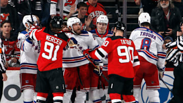 NEWARK, NEW JERSEY - APRIL 27: Ryan Lindgren #55 of the New York Rangers exchanges words with Tomas Tatar #90 of the New Jersey Devils during the first period in Game Five of the First Round of the 2023 Stanley Cup Playoffs at Prudential Center on April 27, 2023 in Newark, New Jersey. (Photo by Bruce Bennett/Getty Images)
