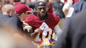 Sep 14, 2014; Landover, MD, USA; Washington Redskins quarterback Robert Griffin III (10) is carted of the field after being injured against the Jacksonville Jaguars in the first quarter at FedEx Field. Mandatory Credit: Geoff Burke-USA TODAY Sports