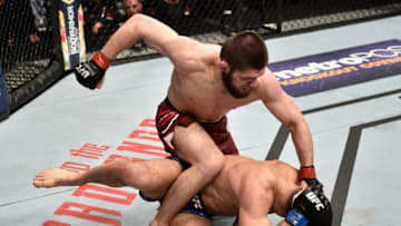 BROOKLYN, NEW YORK - APRIL 07: (L-R) Khabib Nurmagomedov of Russia punches Al Iaquinta in their lightweight title bout during the UFC 223 event inside Barclays Center on April 7, 2018 in Brooklyn, New York. (Photo by Jeff Bottari/Zuffa LLC/Zuffa LLC via Getty Images)
