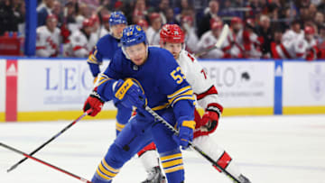 Apr 8, 2023; Buffalo, New York, USA; Buffalo Sabres left wing Jeff Skinner (53) controls the puck as Carolina Hurricanes defenseman Jaccob Slavin (74) defends during the second period at KeyBank Center. Mandatory Credit: Timothy T. Ludwig-USA TODAY Sports