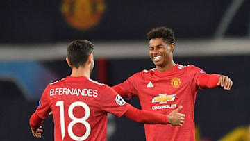 Manchester United's English striker Marcus Rashford (R) celebrates scoring his team's third goal, his second, with Manchester United's Portuguese midfielder Bruno Fernandes, during the UEFA Champions league group H football match between Manchester United and RB Leipzig at Old Trafford stadium in Manchester, north west England, on October 28, 2020. (Photo by Anthony Devlin / AFP) (Photo by ANTHONY DEVLIN/AFP via Getty Images)