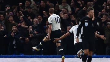 Tottenham Hotspur's English striker Harry Kane (L) celebrates in front of the away fans after scoring the opening goal during the English Premier League football match between Chelsea and Tottenham Hotspur at Stamford Bridge in London on May 2, 2016. / AFP / BEN STANSALL / RESTRICTED TO EDITORIAL USE. No use with unauthorized audio, video, data, fixture lists, club/league logos or 'live' services. Online in-match use limited to 75 images, no video emulation. No use in betting, games or single club/league/player publications. / (Photo credit should read BEN STANSALL/AFP/Getty Images)