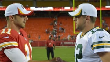 Aug 29, 2013; Kansas City, MO, USA; Kansas City Chiefs quarterback Alex Smith (11) talks with Green Bay Packers quarterback Aaron Rodgers (12) after the game at Arrowhead Stadium. The Chiefs won 30-8. Mandatory Credit: Denny Medley-USA TODAY Sports