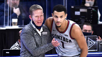 Jan 23, 2021; Spokane, Washington, USA; Gonzaga Bulldogs head coach Mark Few reacts while talking with guard Jalen Suggs (1) during the second half against the Pacific Tigers in at McCarthey Athletic Center. Mandatory Credit: James Snook-USA TODAY Sports