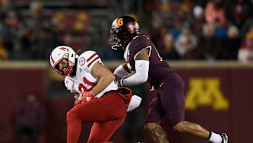 MINNEAPOLIS, MINNESOTA - OCTOBER 12: Kade Warner #81 of the Nebraska Cornhuskers catches a pass against Chris Williamson #6 of the Minnesota Gophers during the third quarter of the game at TCF Bank Stadium on October 12, 2019 in Minneapolis, Minnesota. The Gophers defeated the Cornhuskers 34-7. (Photo by Hannah Foslien/Getty Images)