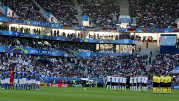 BORDEAUX, FRANCE - JULY 2: Players and Fans stand in silence for the victims of the Istanbul Ataturk Airport terror attack, prior to the UEFA Euro 2016 quarter final match between Germany and Italy at Stade de Bordeaux in Bordeaux, France on July 2, 2016. (Photo by Metin Pala/Anadolu Agency/Getty Images)