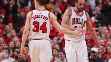 May 10, 2015; Chicago, IL, USA; Chicago Bulls center Joakim Noah (13) celebrates with Mike Dunleavy (34) after drawing a foul in the first half of game four of the second round of the NBA Playoffs against the Cleveland Cavaliers at the United Center. Mandatory Credit: Dennis Wierzbicki-USA TODAY Sports