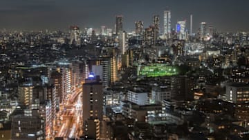 TOKYO, JAPAN - DECEMBER 23: The Tokyo skyline is picture after dusk on December 23, 2020 in Tokyo, Japan. The Tokyo Metropolitan Government announced 748 new cases of Covid-19 coronavirus today as infections continue to fluctuate nationwide. To date, Japan has recorded 203,732 infections, 2,877 and 169,186 recoveries from the virus. (Photo by Carl Court/Getty Images)