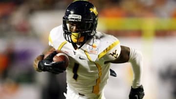 Jan 4, 2012; Miami Gardens, FL, USA; West Virginia Mountaineers wide receiver Tavon Austin (1) rushes for yardage during the first quarter against the Clemson Tigers in the 2012 Orange Bowl at Sun Life Stadium. Mandatory Credit: Douglas Jones-USA TODAY Sports