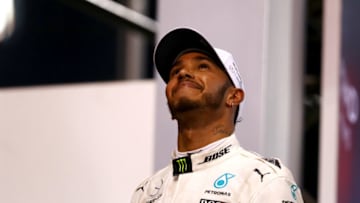 ABU DHABI, UNITED ARAB EMIRATES - NOVEMBER 26: Second place finisher Lewis Hamilton of Great Britain and Mercedes GP celebrates with his trophy on the podium during the Abu Dhabi Formula One Grand Prix at Yas Marina Circuit on November 26, 2017 in Abu Dhabi, United Arab Emirates. (Photo by Dan Istitene/Getty Images)