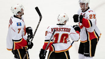 Dec 27, 2016; Denver, CO, USA; Calgary Flames right wing Kris Versteeg (10) celebrates his goal with center Sean Monahan (23) and defenseman TJ Brodie (7) in the third period against the Colorado Avalanche at the Pepsi Center. The Flames won 6-3. Mandatory Credit: Isaiah J. Downing-USA TODAY Sports