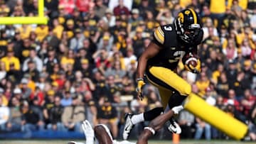 Oct 22, 2016; Iowa City, IA, USA; Wisconsin Badgers safety Lubern Figaro (31) makes a shoelace tackle on Iowa Hawkeyes wide receiver Jay Scheel (3) at Kinnick Stadium. Mandatory Credit: Reese Strickland-USA TODAY Sports