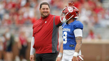 Oklahoma Offensive Coordinator Jeff Lebby pats Dillon Gabriel (8) on the helmet during the University of Oklahoma's annual spring football game at Gaylord Family-Oklahoma Memorial Stadium in Norman, Okla., Saturday, April 23, 2022.Ou Sooners Spring Football Game