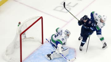 EDMONTON, ALBERTA - JULY 29: Jacob Markstrom #25 of the Vancouver Canucks tends goal against Nick Shore #21 of the Winnipeg Jets during the second period in an exhibition game prior to the 2020 NHL Stanley Cup Playoffs at Rogers Place on July 29, 2020 in Edmonton, Alberta. (Photo by Jeff Vinnick/Getty Images)