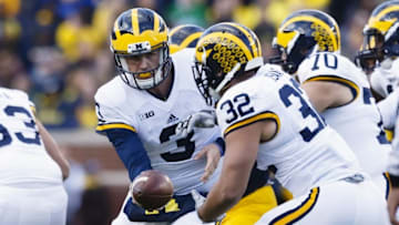 Apr 1, 2016; Ann Arbor, MI, USA; Michigan Wolverines quarterback Wilton Speight (3) hands off to running back Ty Isaac (32) during the spring game at Michigan Stadium. Mandatory Credit: Rick Osentoski-USA TODAY Sports