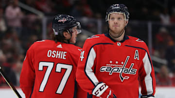 WASHINGTON, DC - NOVEMBER 15: John Carlson #74 of the Washington Capitals and T.J. Oshie #77 of the Washington Capitals look on against the Montreal Canadiens during the first period at Capital One Arena on November 15, 2019 in Washington, DC. (Photo by Patrick Smith/Getty Images)
