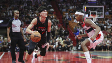 Nov 3, 2023; Miami, Florida, USA; Miami Heat guard Tyler Herro (14) dribbles the basketball as Washington Wizards guard Bilal Coulibaly (0) defends during the fourth quarter at Kaseya Center. Mandatory Credit: Sam Navarro-USA TODAY Sports