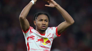 Leipzig's French midfielder Christopher Nkunku celebrates scoring during the penalty shoot-out of the German Cup (DFB Pokal) final football match between SC Freiburg and RB Leipzig at the Olympic Stadium in Berlin on May 21, 2022. - - DFB REGULATIONS PROHIBIT ANY USE OF PHOTOGRAPHS AS IMAGE SEQUENCES AND QUASI-VIDEO. (Photo by RONNY HARTMANN / AFP) / DFB REGULATIONS PROHIBIT ANY USE OF PHOTOGRAPHS AS IMAGE SEQUENCES AND QUASI-VIDEO. (Photo by RONNY HARTMANN/AFP via Getty Images)