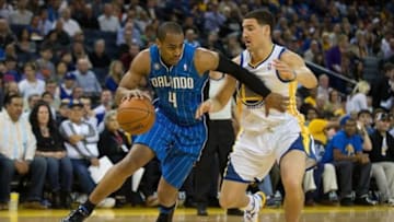 Mar 18, 2014; Oakland, CA, USA; Orlando Magic guard Arron Afflalo (4) drives in against Golden State Warriors guard Klay Thompson (11) during the first quarter at Oracle Arena. Mandatory Credit: Kelley L Cox-USA TODAY Sports