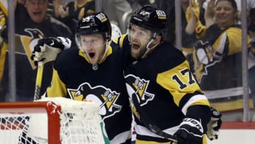 May 9, 2022; Pittsburgh, Pennsylvania, USA; Pittsburgh Penguins left wing Jake Guentzel (59) and right wing Bryan Rust (17) celebrate a goal by Guentzel against the New York Rangers during the second period in game four of the first round of the 2022 Stanley Cup Playoffs at PPG Paints Arena. Mandatory Credit: Charles LeClaire-USA TODAY Sports