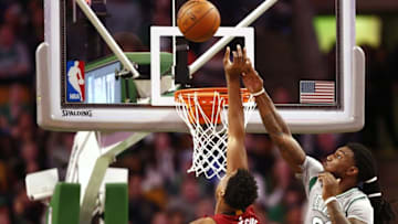 Apr 13, 2016; Boston, MA, USA; Boston Celtics forward Jae Crowder (99) fouls Miami Heat center Hassan Whiteside (21) during the second half at TD Garden. Mandatory Credit: Mark L. Baer-USA TODAY Sports